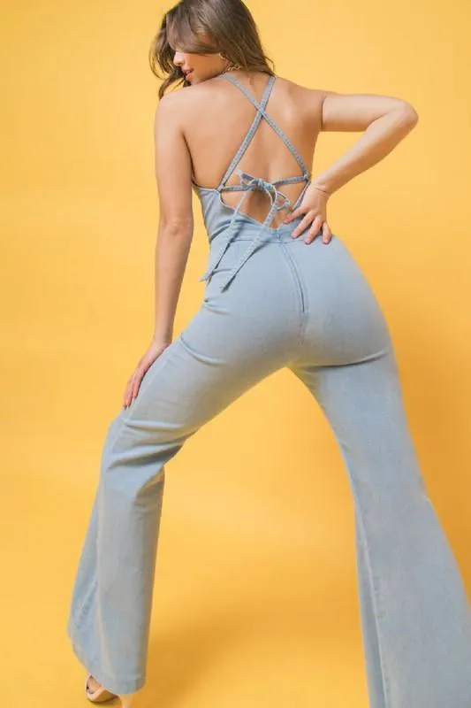 denim jumpsuit featuring halter neckline, flare pant